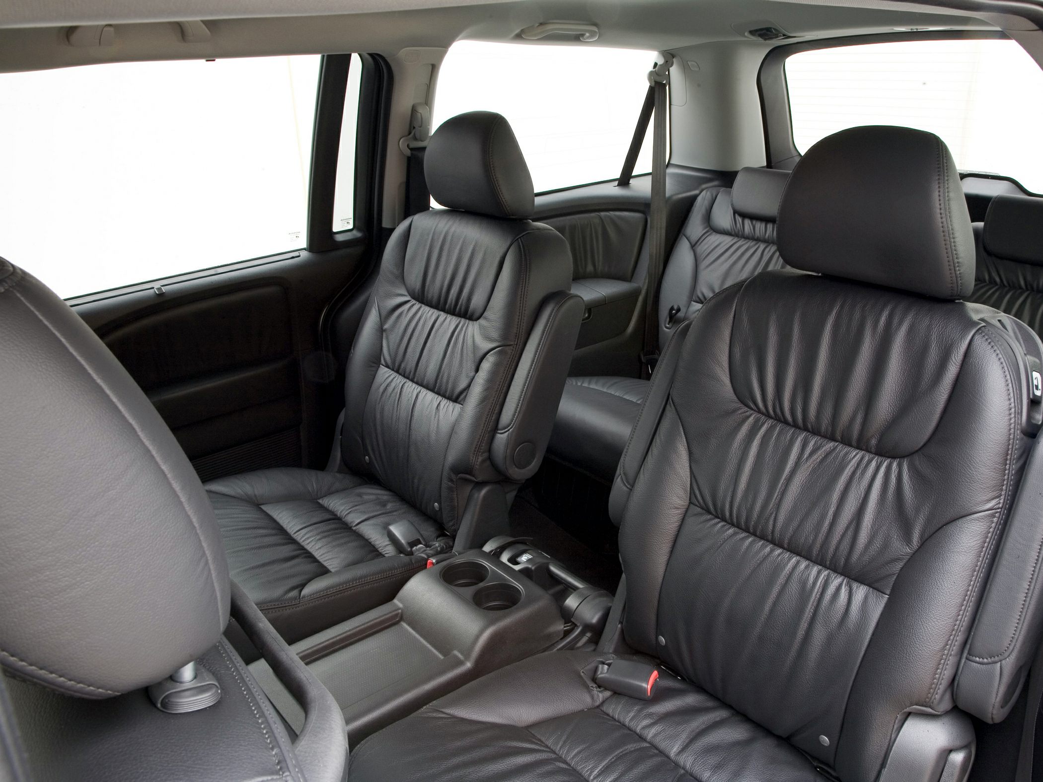 Black leather captain seats with spacious minivan interior