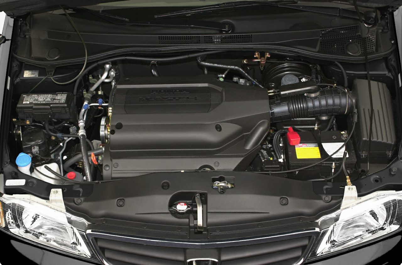 Engine bay and detailed components of a 1999 minivan