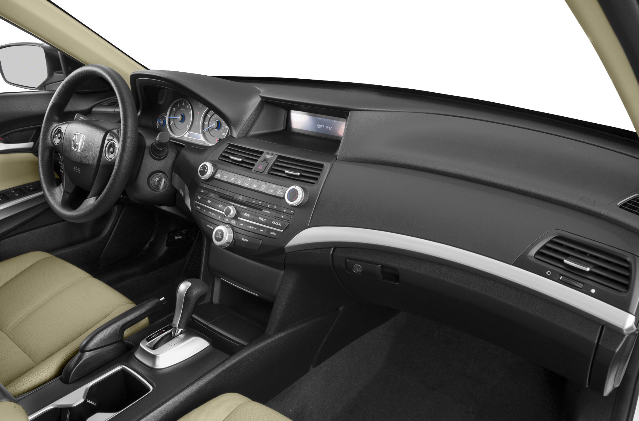 Dashboard with digital display, steering wheel, center console, and gear shift