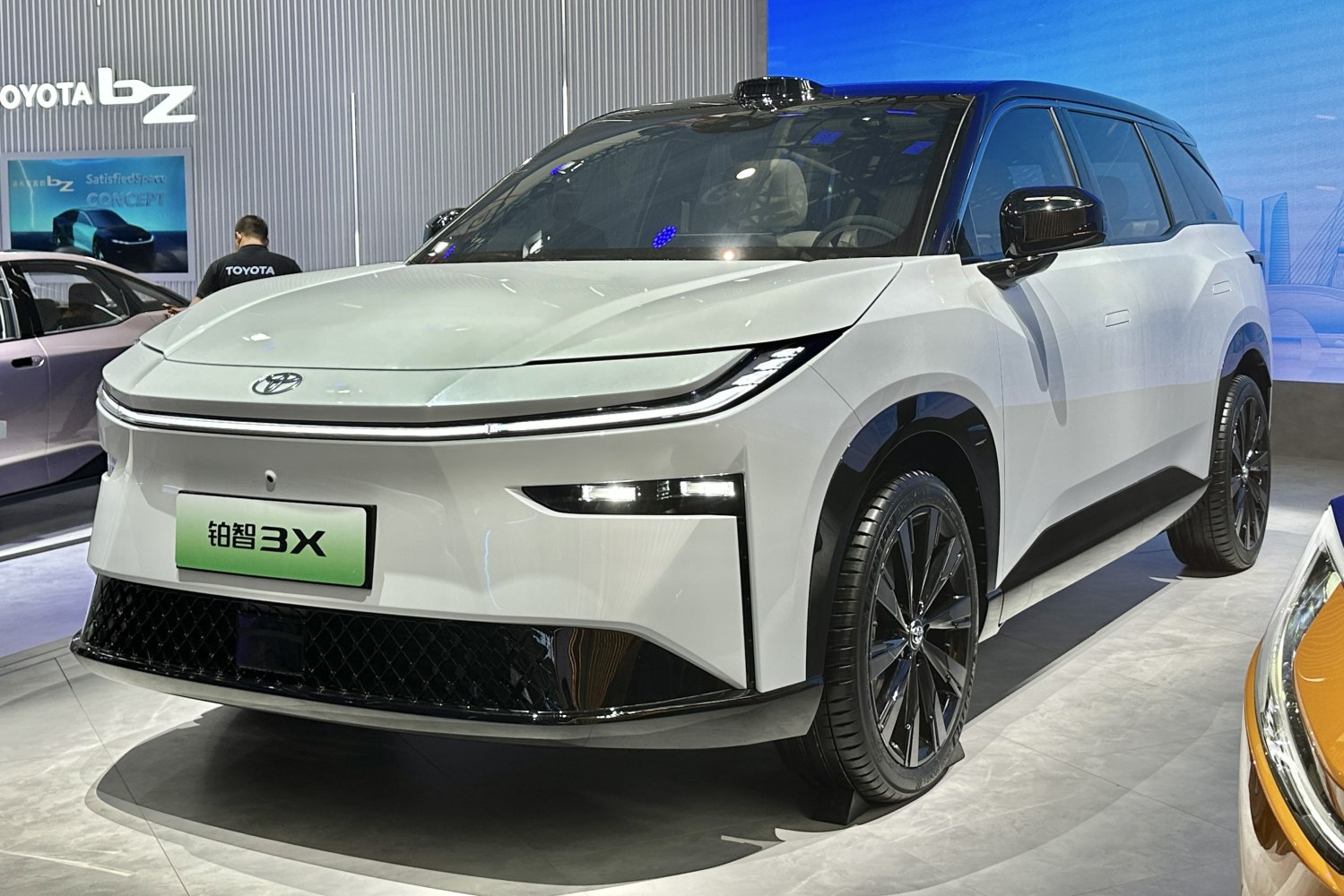 Front view of electric SUV with sleek LED headlights and aerodynamic styling