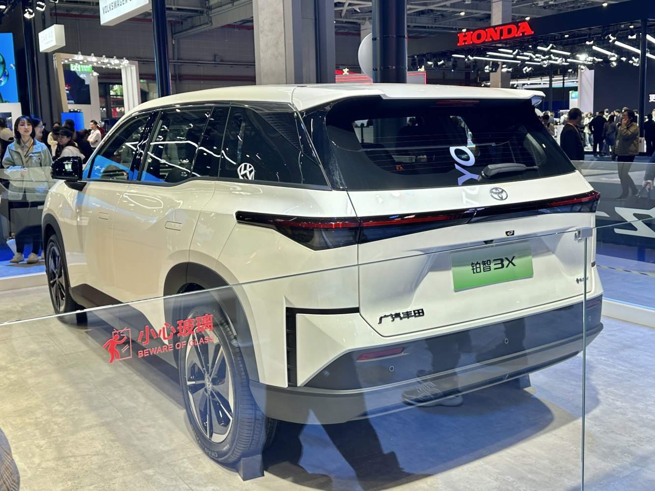 Rear view with sleek LED tail light design and aerodynamic body.