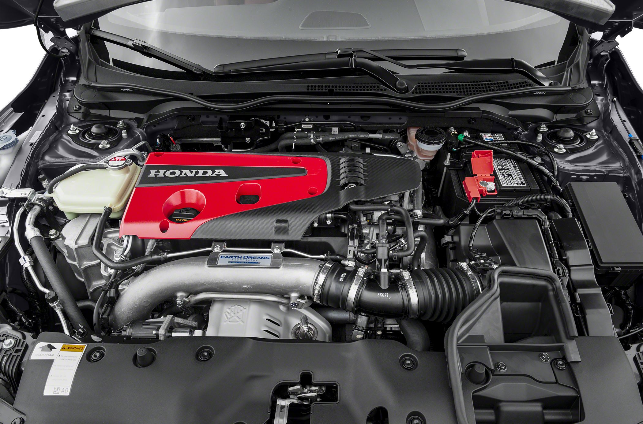 Red valve cover turbocharged engine bay with intake piping