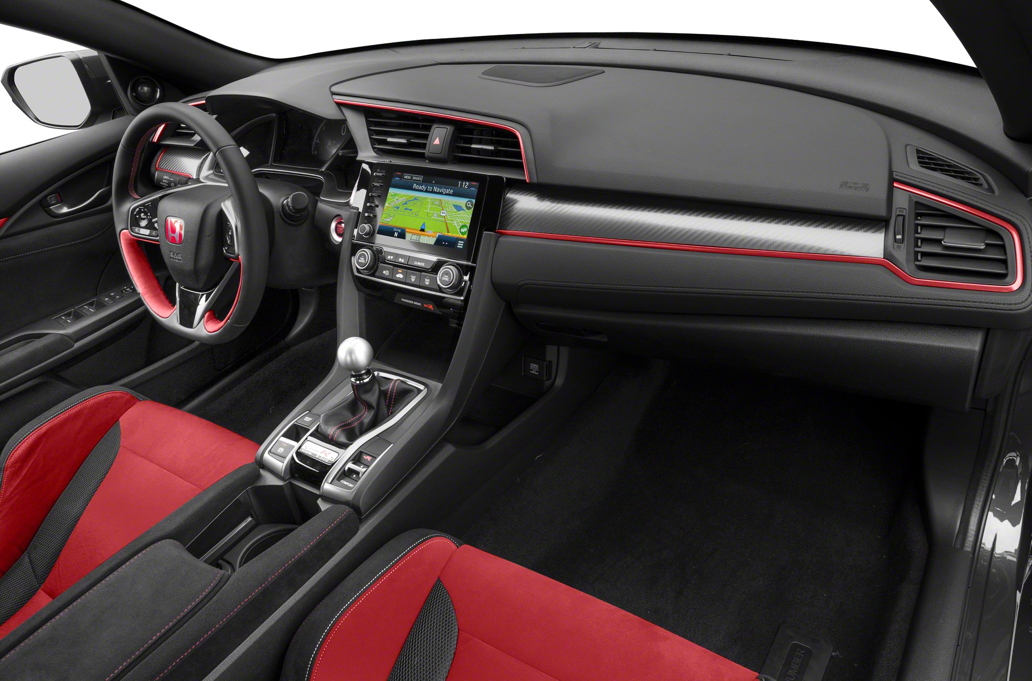 Sporty interior with red-accented seats and manual gear shifter