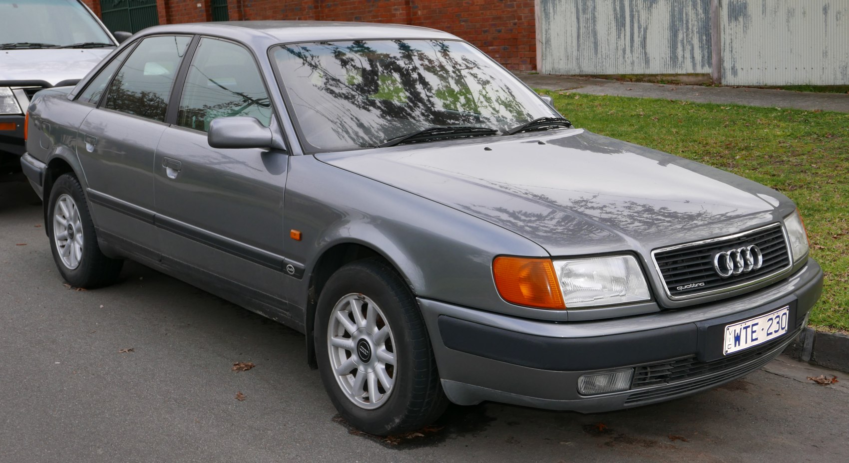 Front-side view of a classic sedan with rectangular headlights and alloy wheels