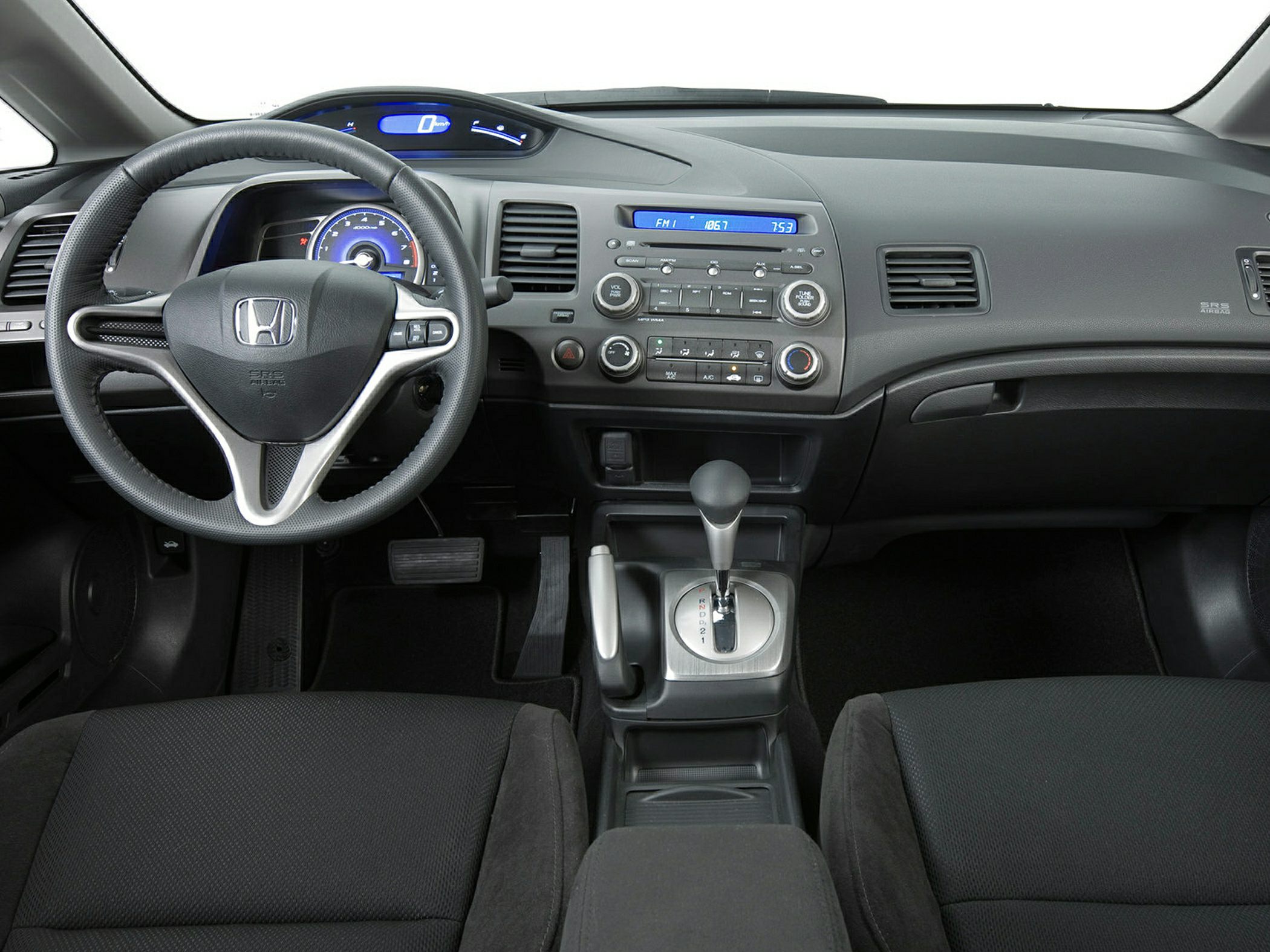 Digital speedometer dashboard and multifunction steering wheel inside a car