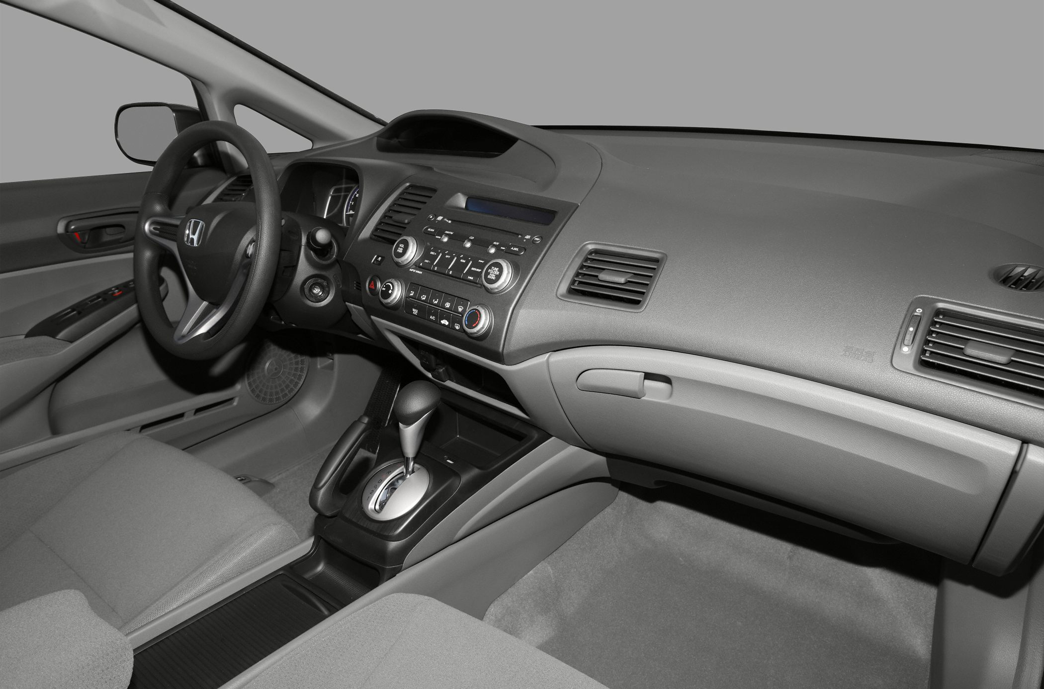 Dashboard with control panel and steering wheel in car interior