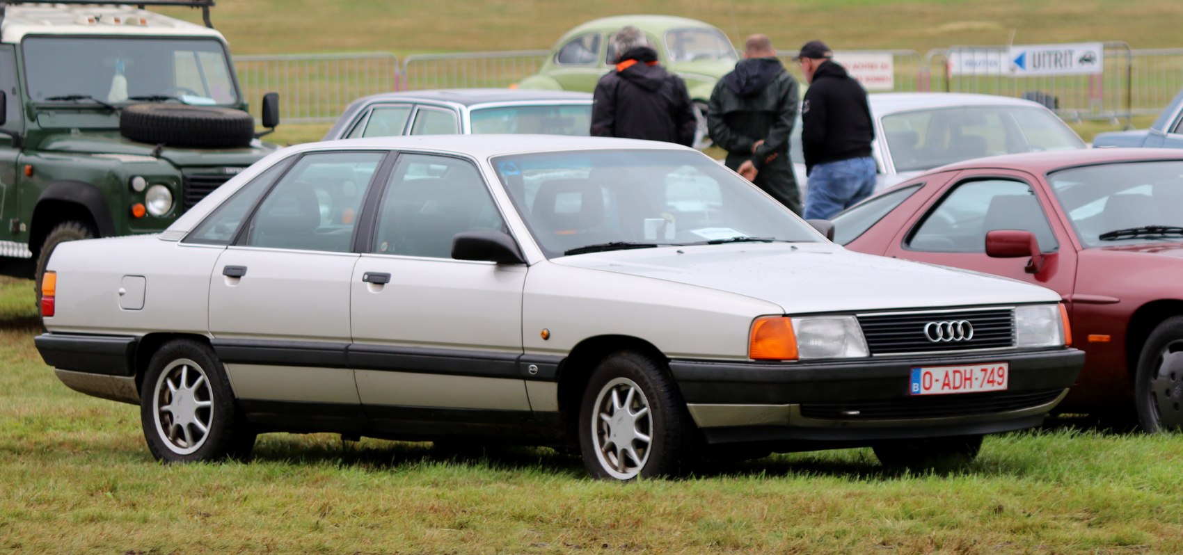 Classic 1980s four-door sedan with rectangular headlights and alloy wheels