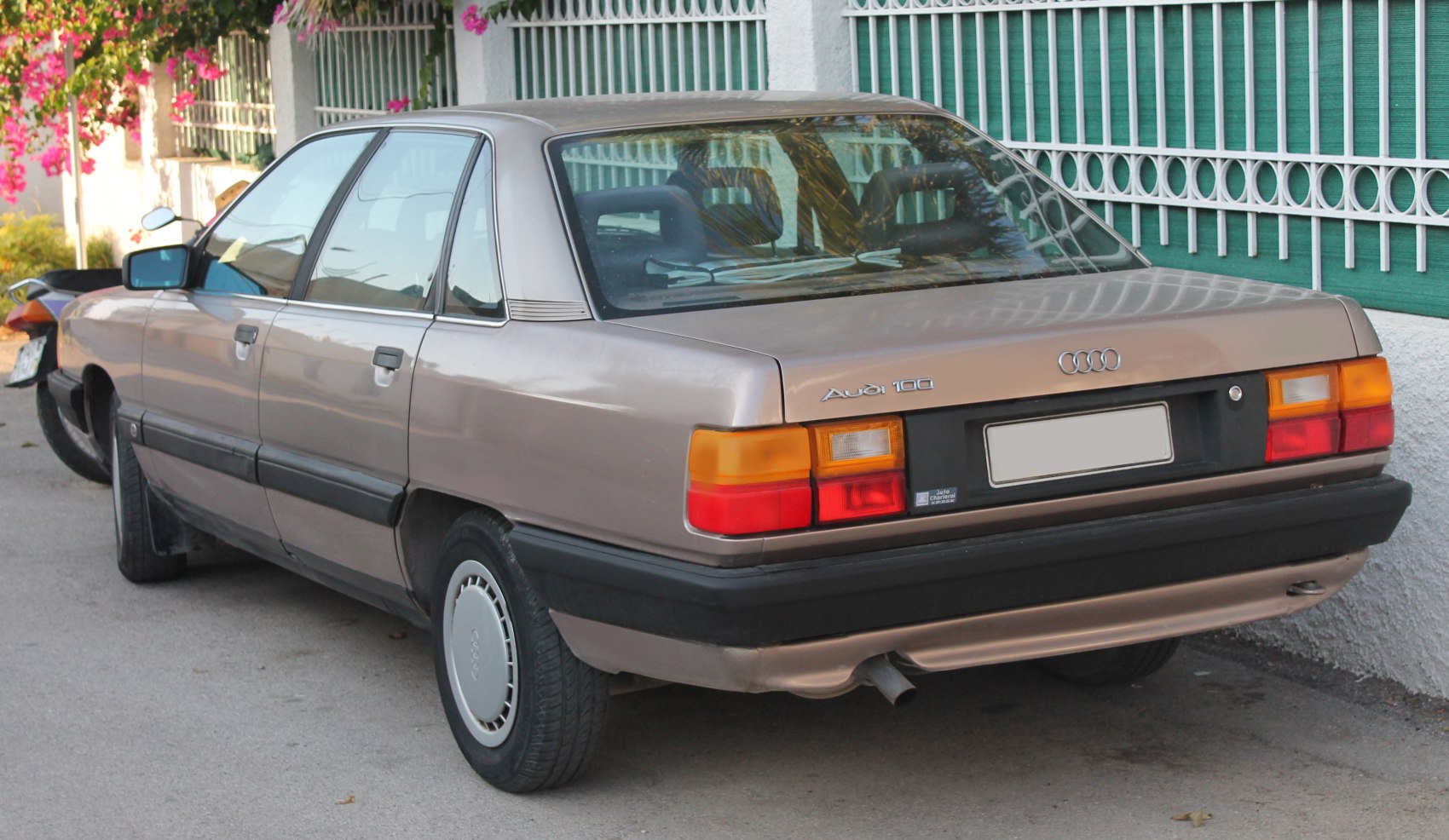 Rear view of 1980s four-door sedan with rectangular taillights and black bumper