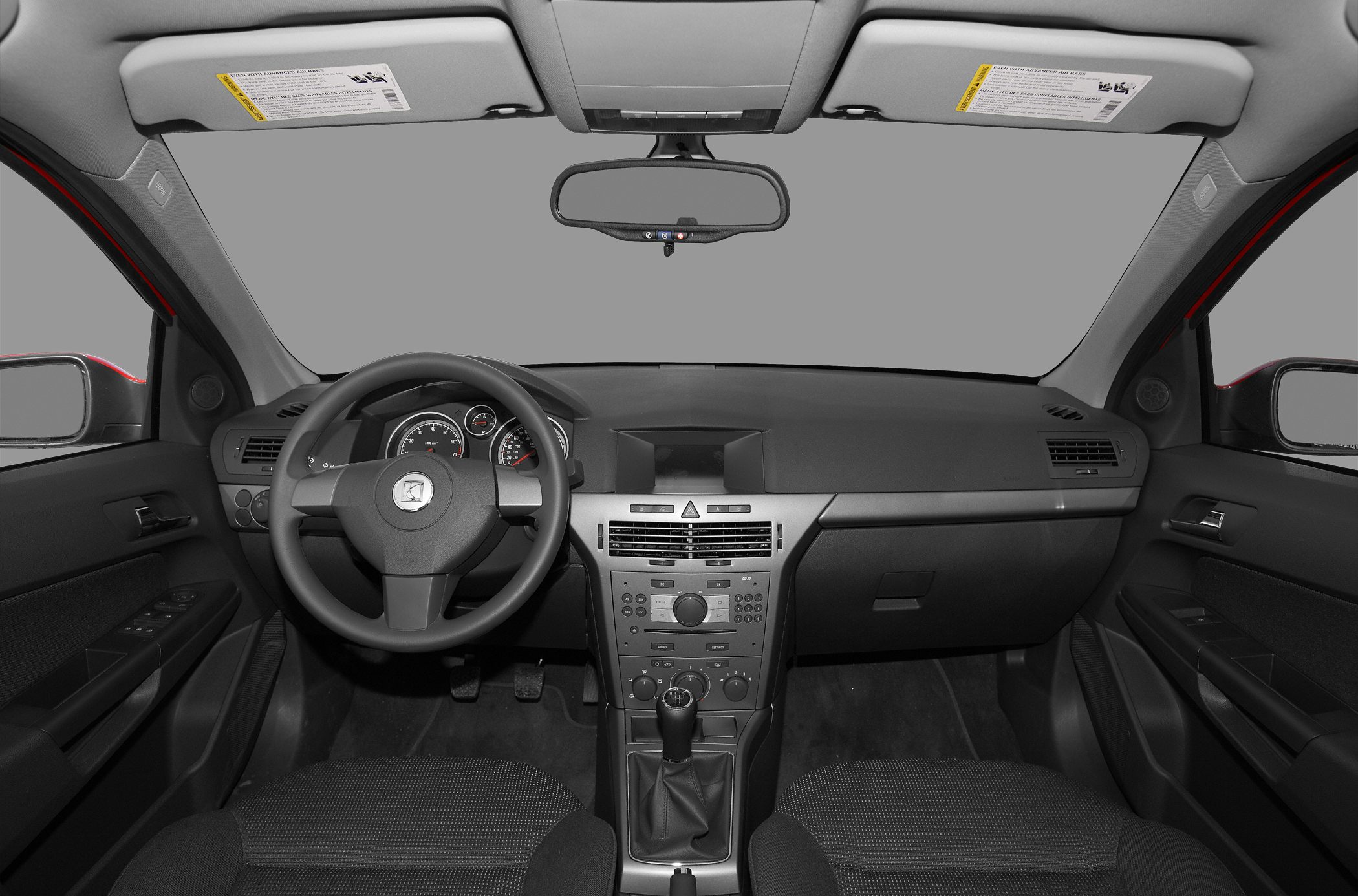 Dashboard, steering wheel, and center console with manual gear shift