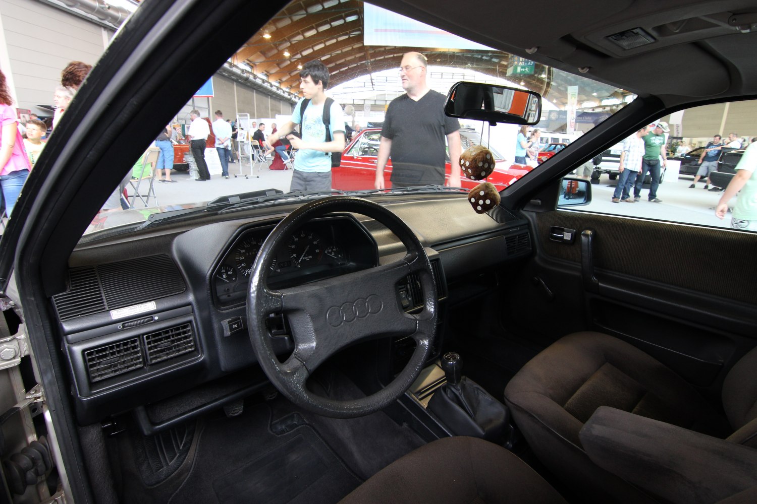 Classic car interior dashboard with steering wheel and manual gearbox