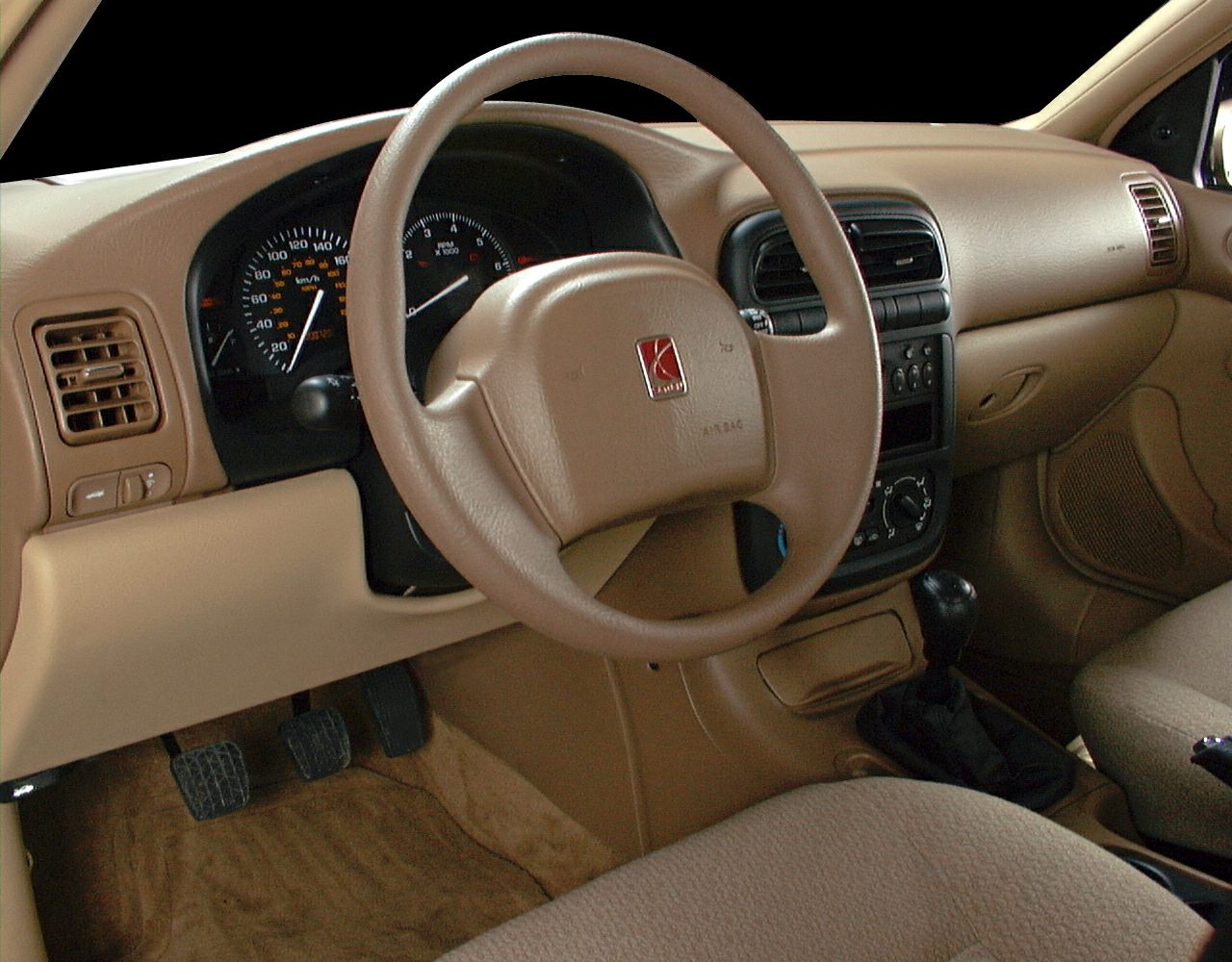 Beige steering wheel and dashboard with manual gear shift
