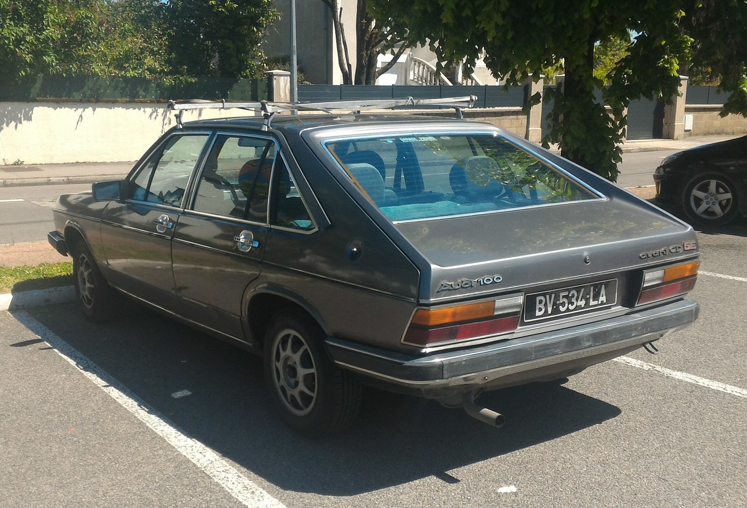 Rear hatchback view of a classic 1979 hatchback with roof rack and distinct tail lights