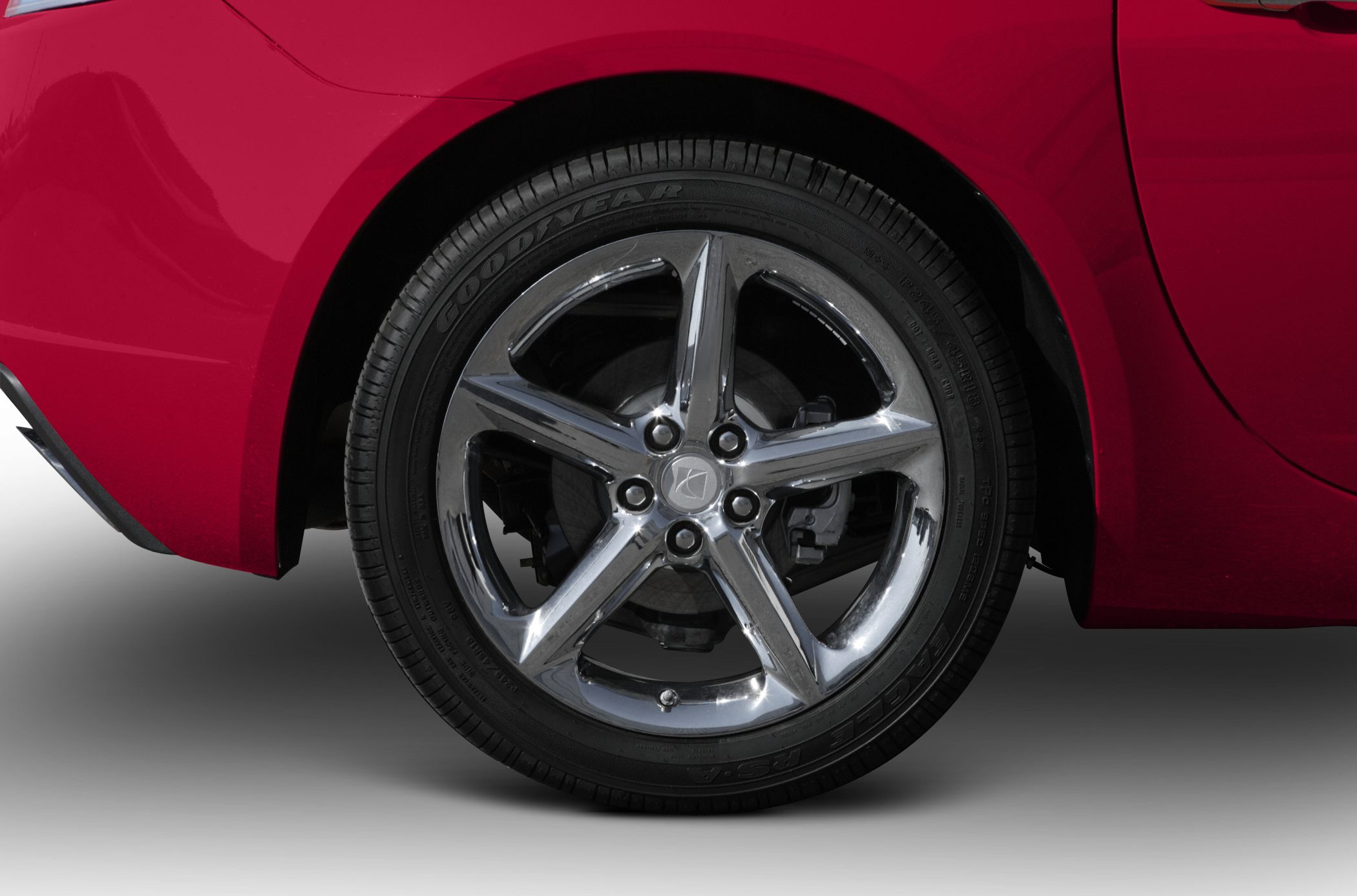 Five-spoke alloy wheel with Goodyear Eagle RS-A tire on red car body
