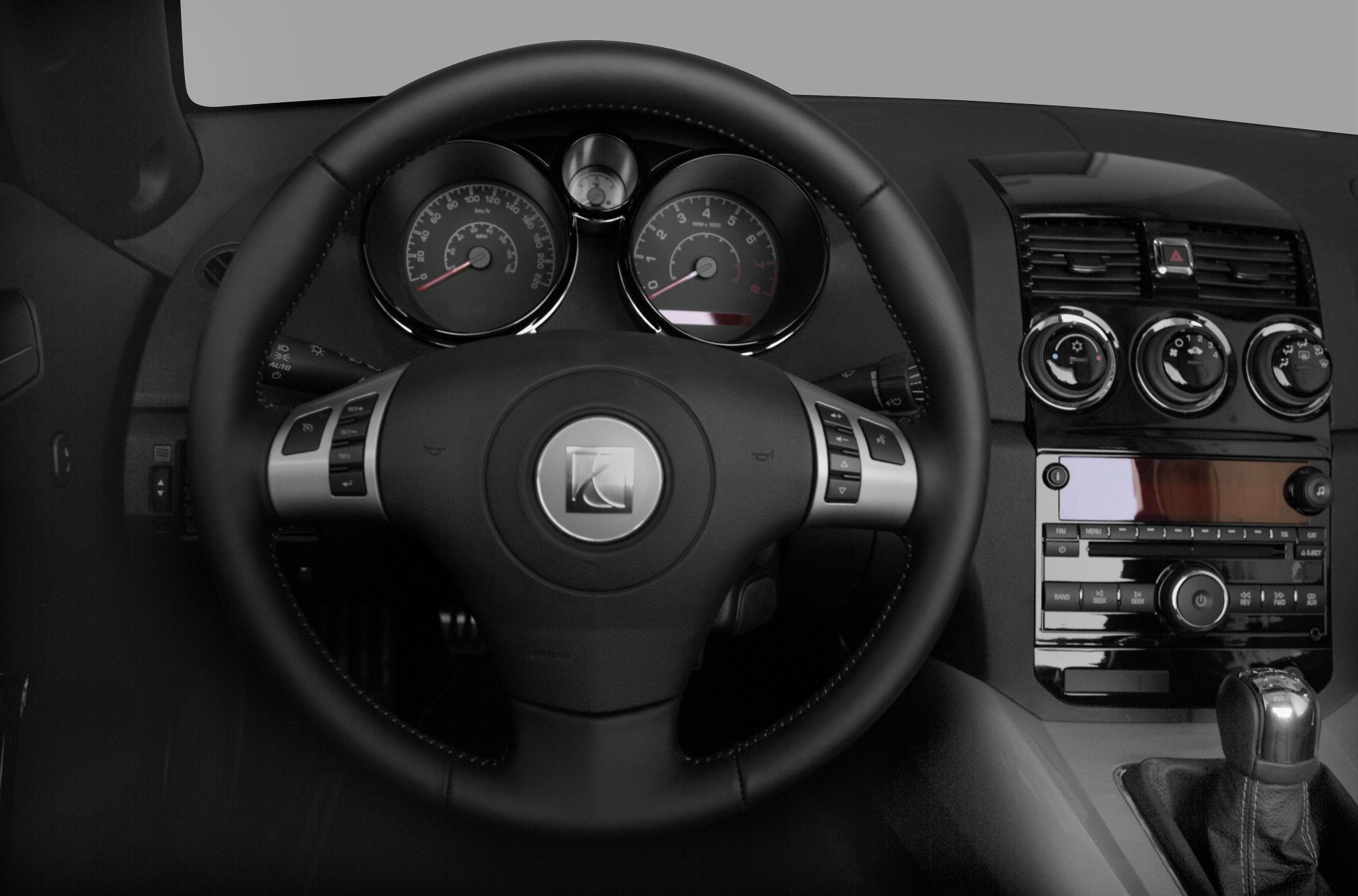 Steering wheel with instrument cluster and center console with climate and audio controls