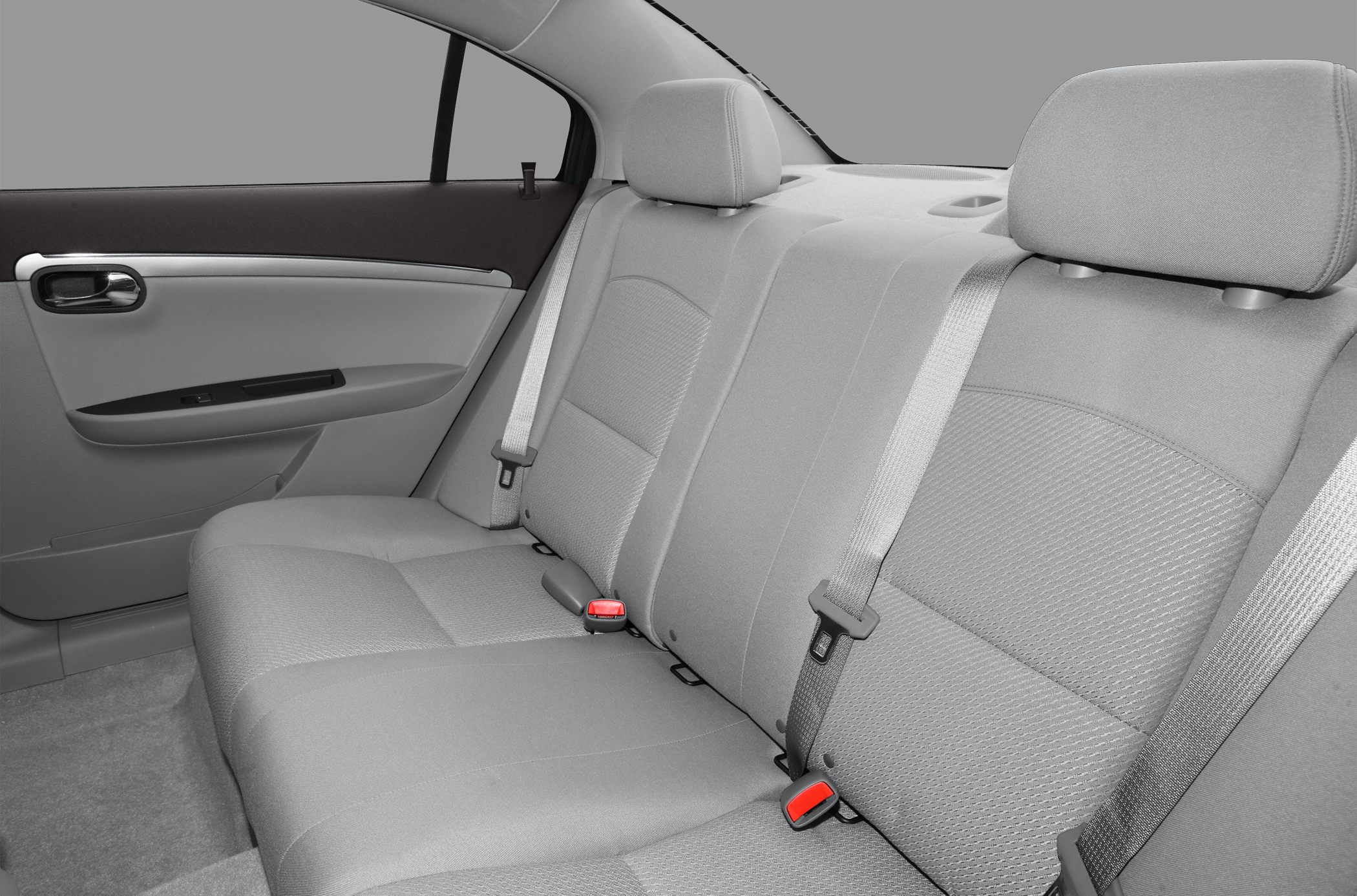 Rear seat fabric upholstery with headrests and seat belts in spacious cabin
