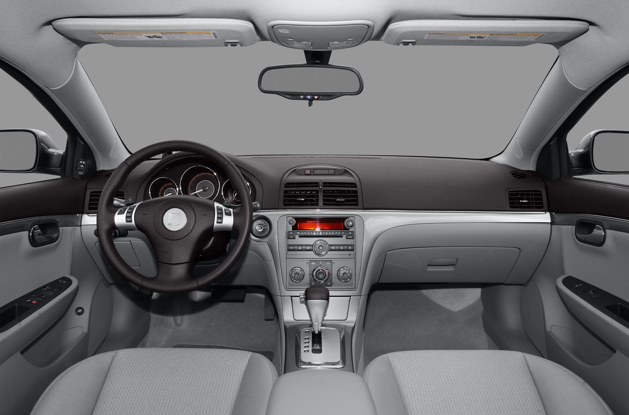Steering wheel and dashboard interior with center console and automatic gear shift