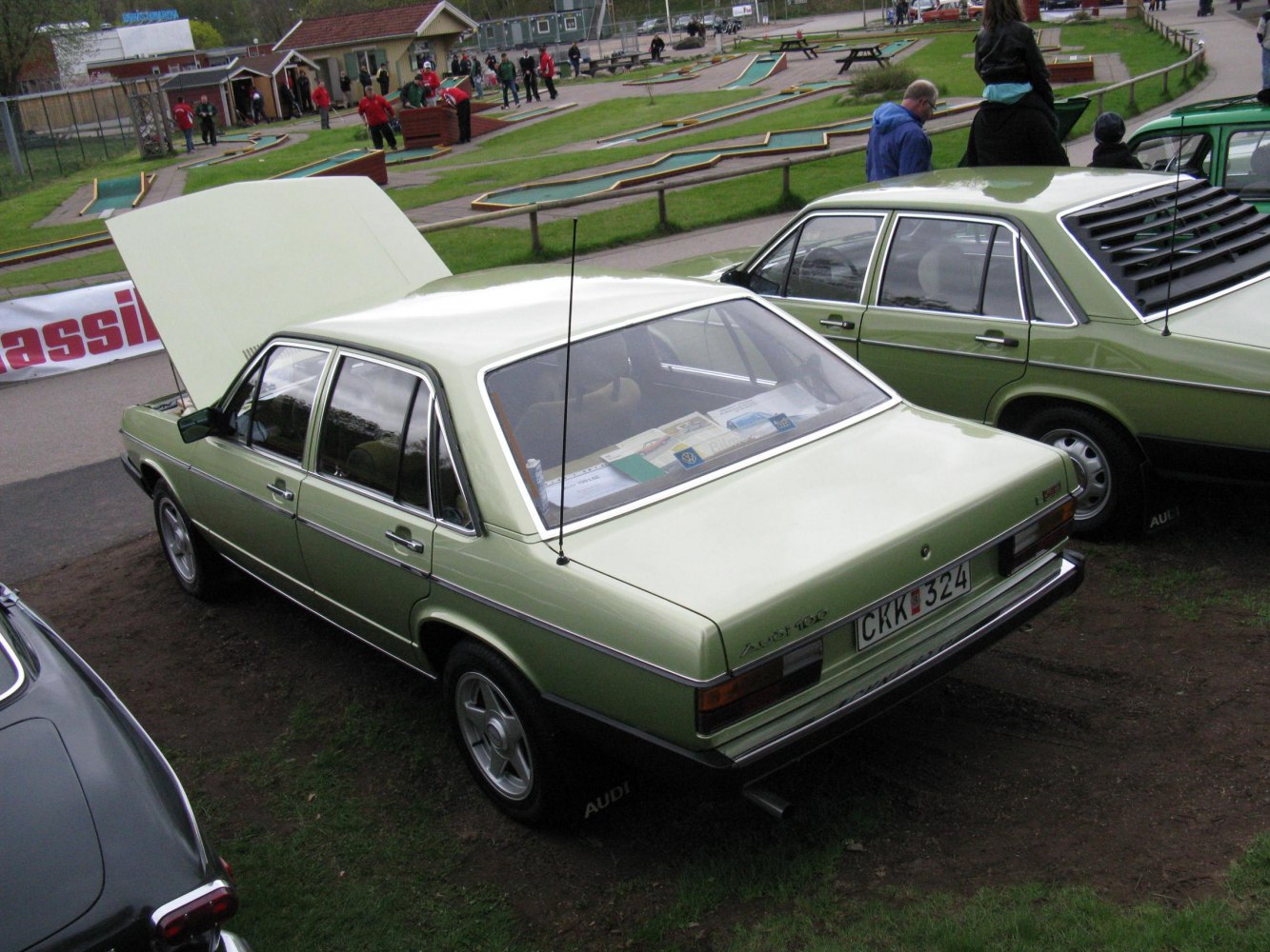 Vintage sedan with rear window louvers and raised hood
