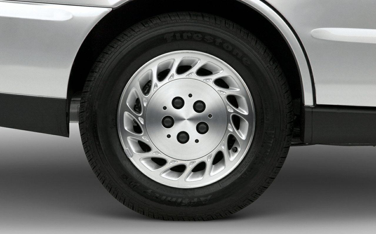 Alloy wheel and tire close-up with unique spoke design