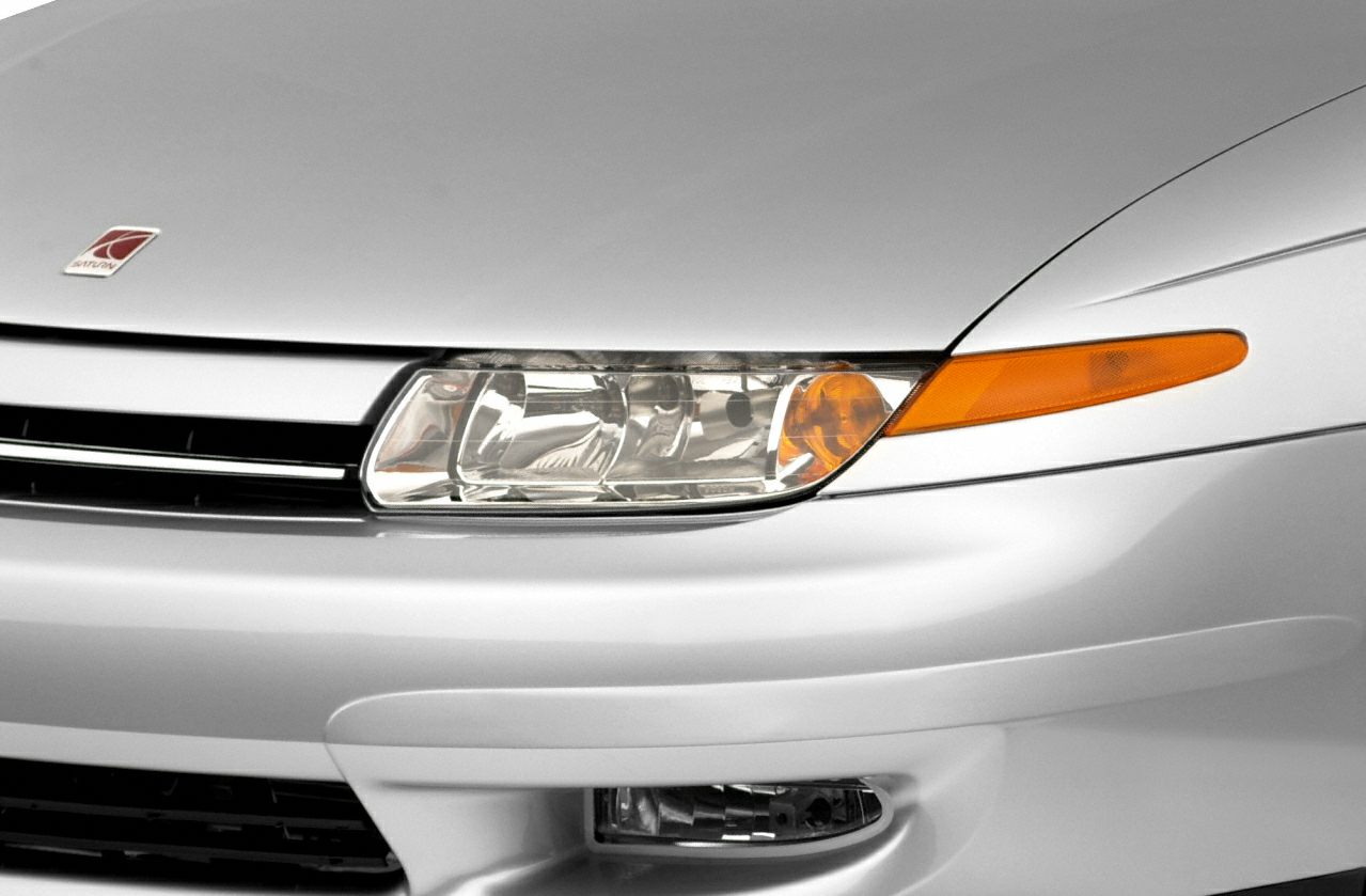 Front left headlight with amber turn signal and bumper detail