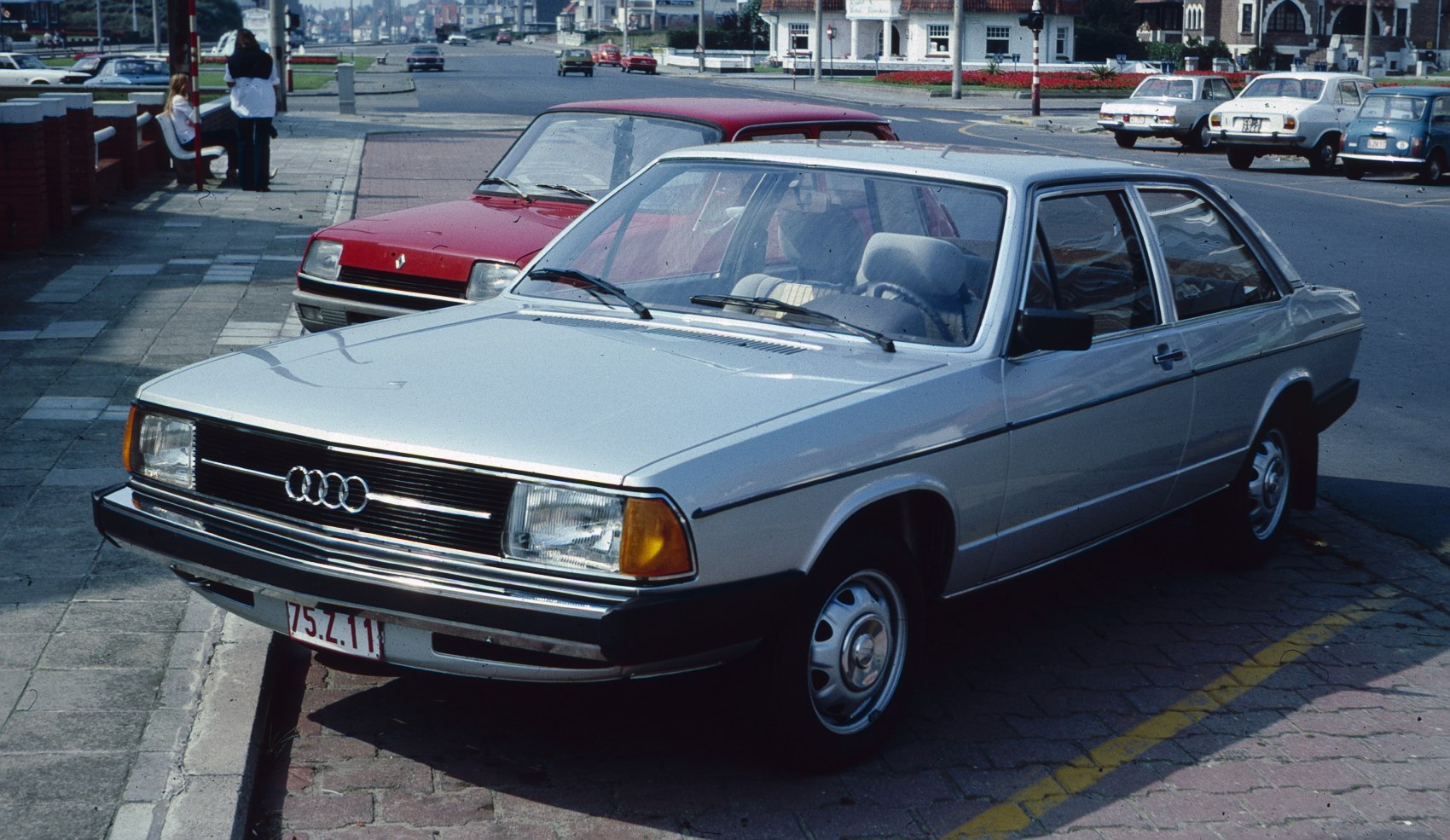 Front-side view of vintage sedan with square headlights and chrome grille