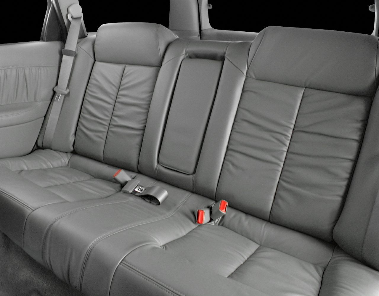 Leather rear seat with seat belts and center armrest