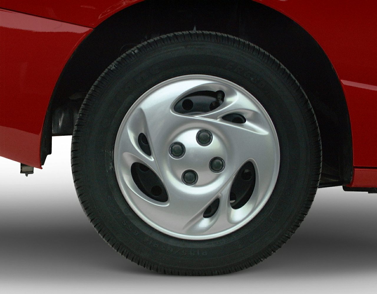 Distinctive silver alloy wheel and tire tread close-up