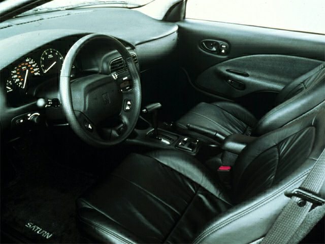 Black leather seats with steering wheel and dashboard interior
