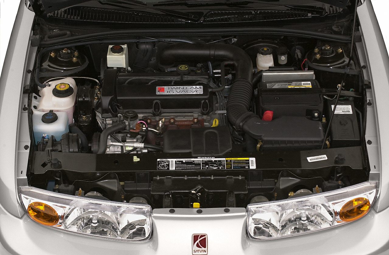 Twin cam 16-valve engine with organized components in engine bay