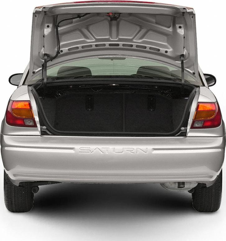 Open rear trunk with visible cargo space and hatch of a compact sedan.