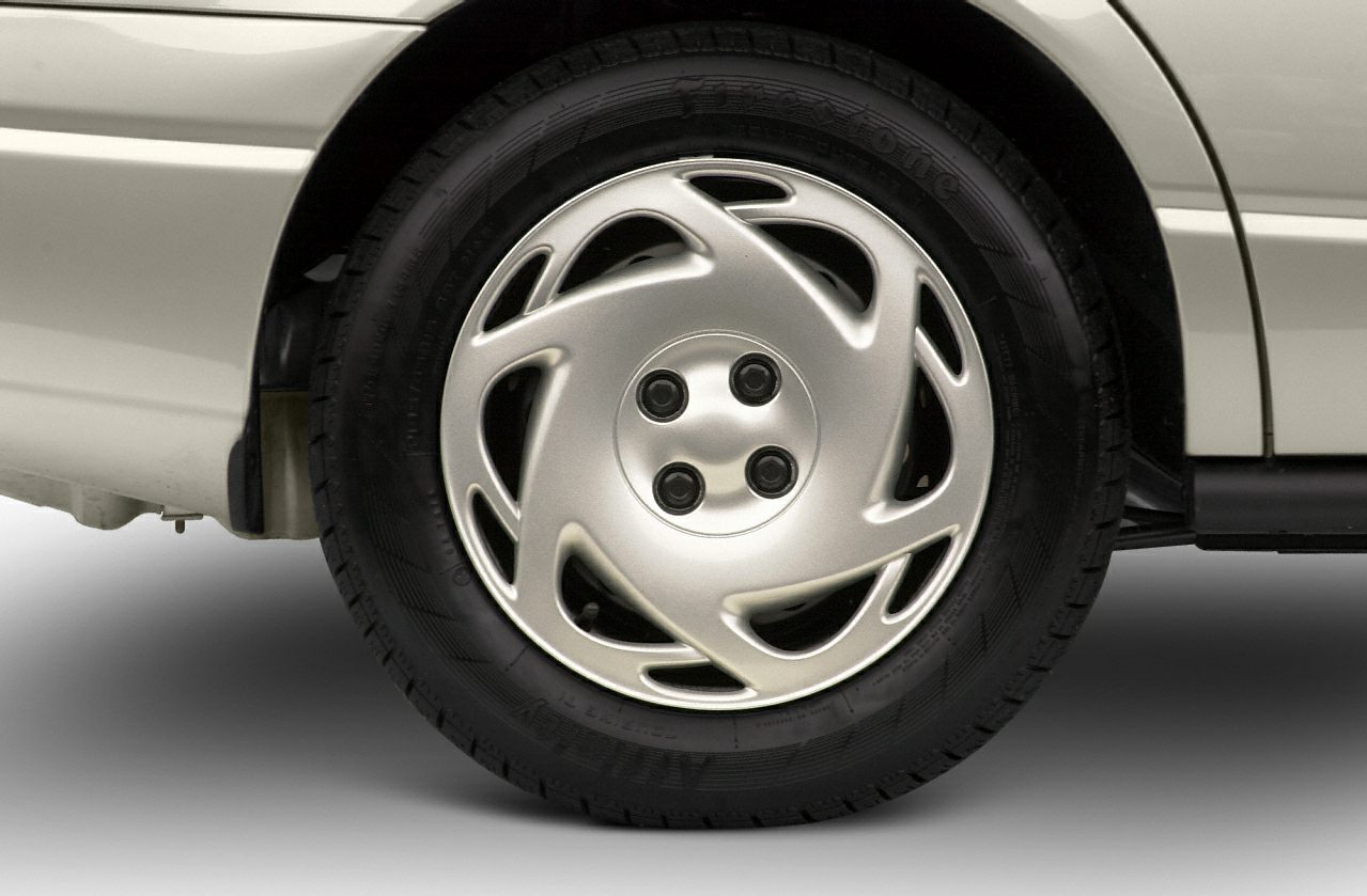 Close-up of distinctive alloy wheel design with unique, curved spoke pattern
