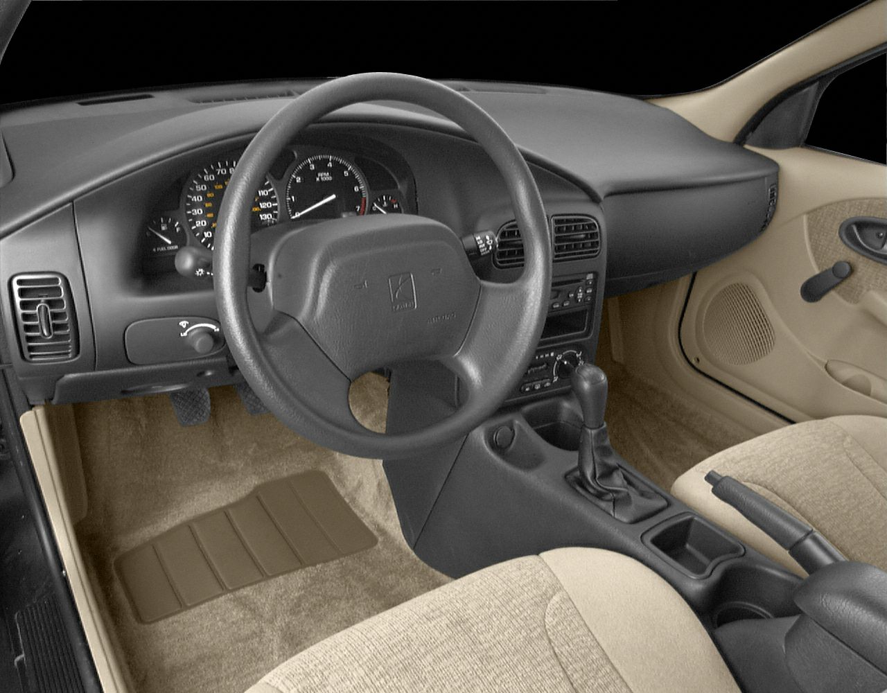 Beige fabric interior with manual transmission and classic dashboard.
