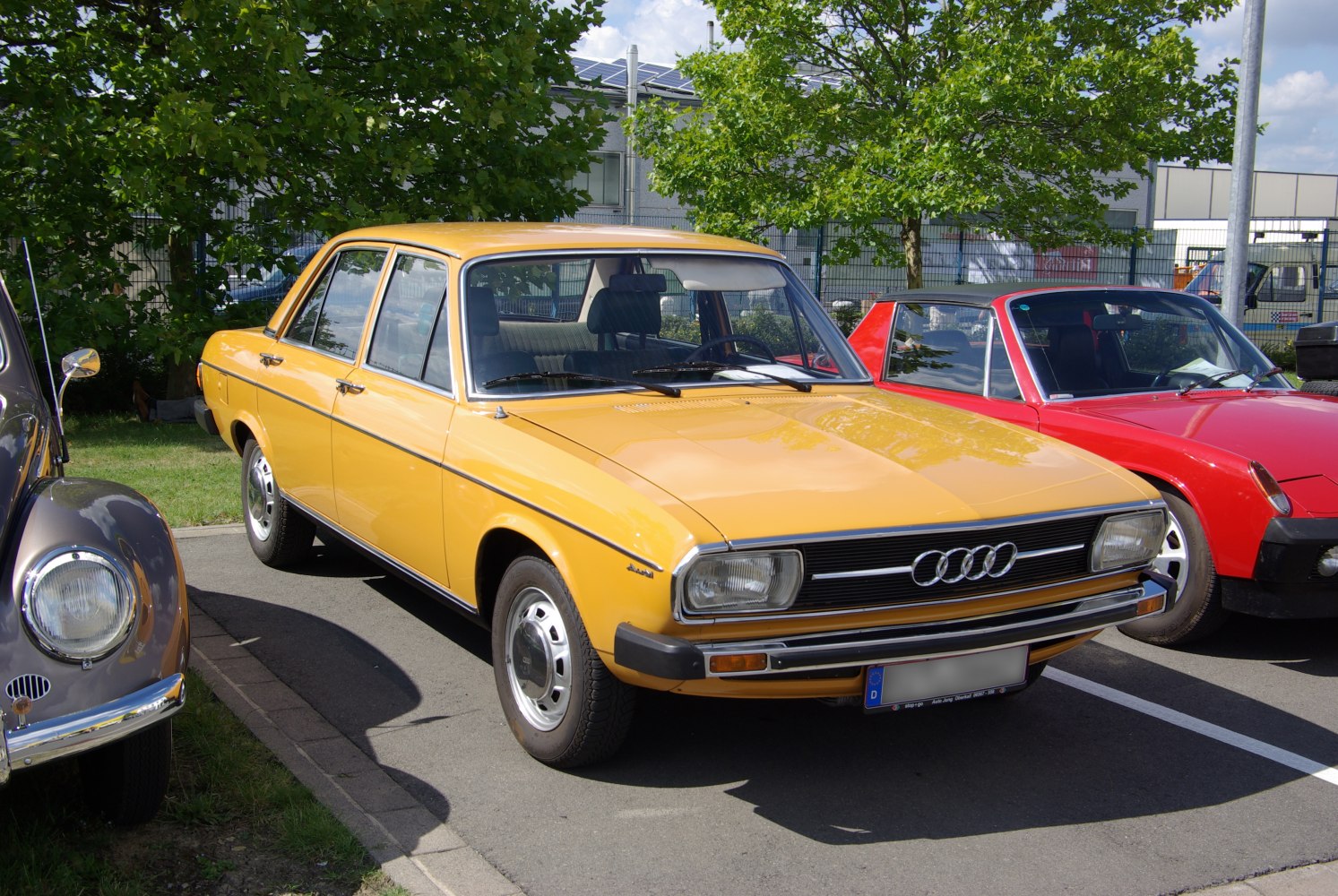 Boxy classic sedan front-side view with iconic Audi grille