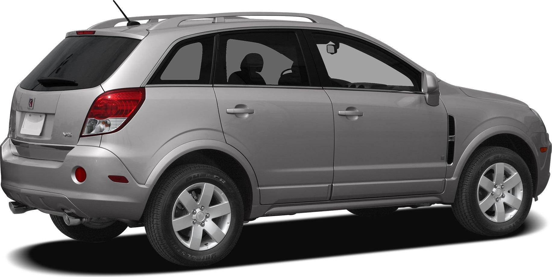 Rear side profile showing alloy wheels, roof rails, and rear taillights