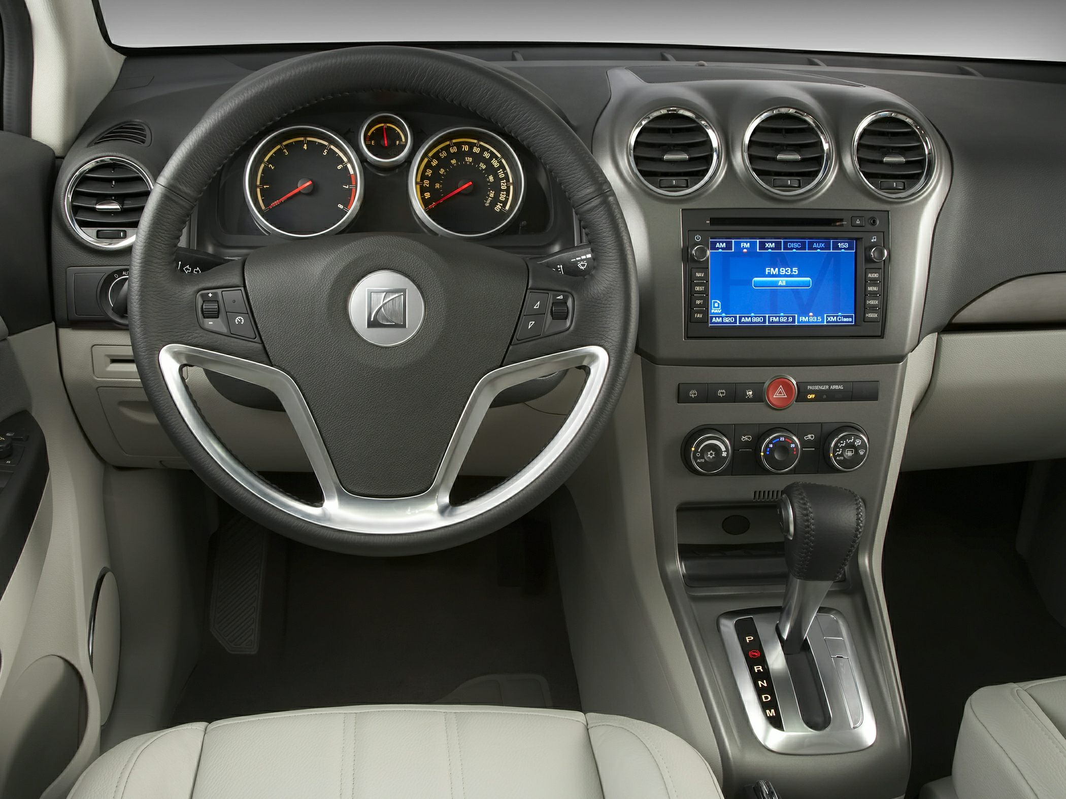 Steering wheel, dashboard, center console with gear shift and infotainment system