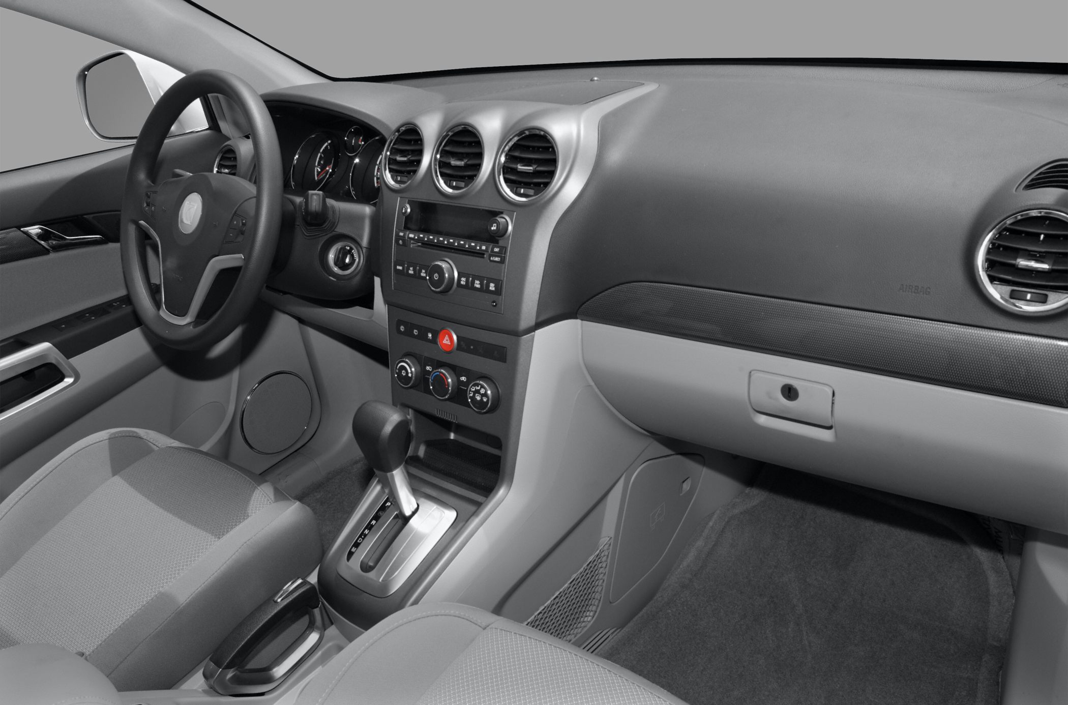 Dashboard, steering wheel, center console with gear shifter and climate controls