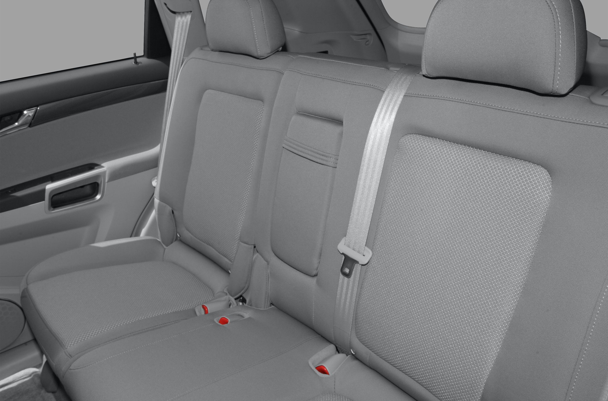 Rear seat interior with headrests, seatbelt, and fabric upholstery