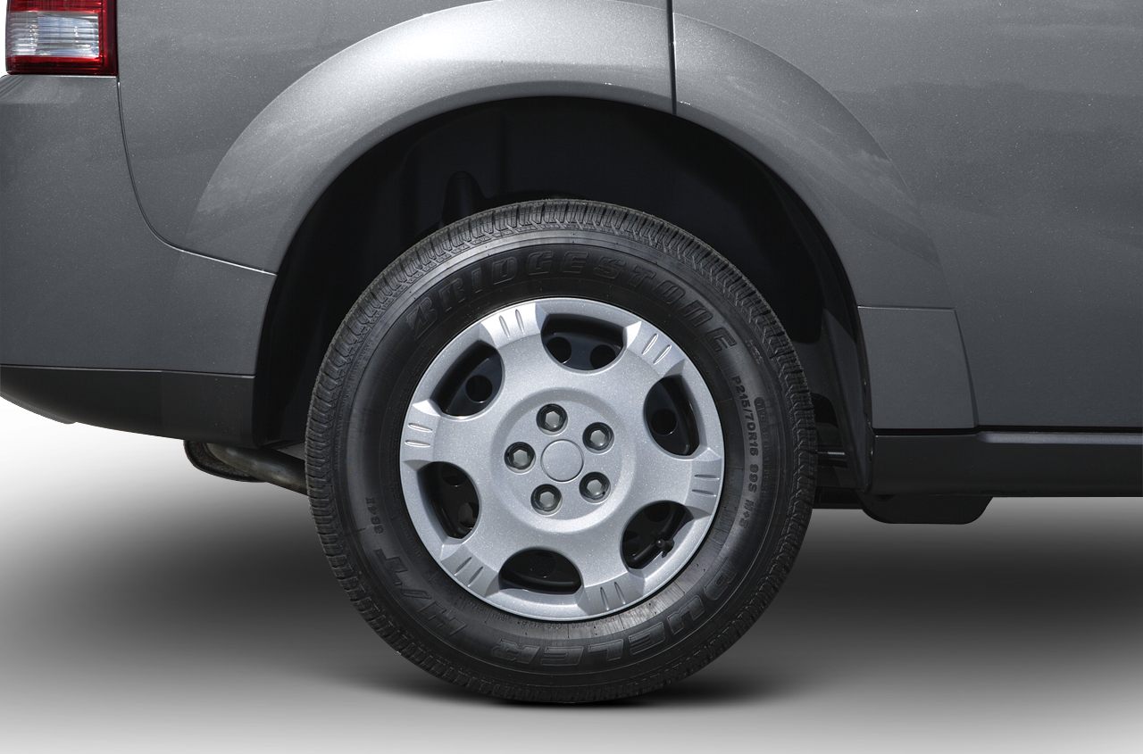 Close-up of a rear wheel with Bridgestone tire and alloy wheel cover