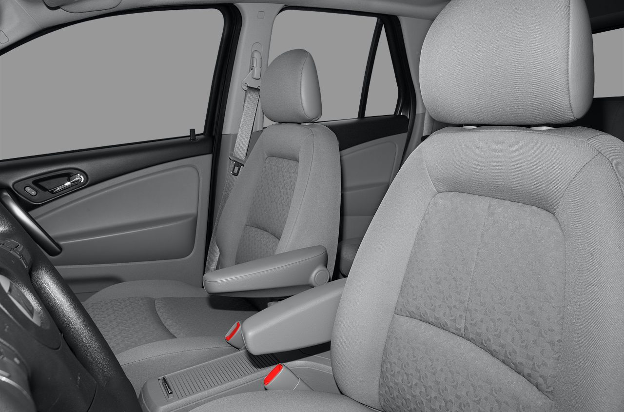 Front seats and door panel upholstery with armrests and seatbelts