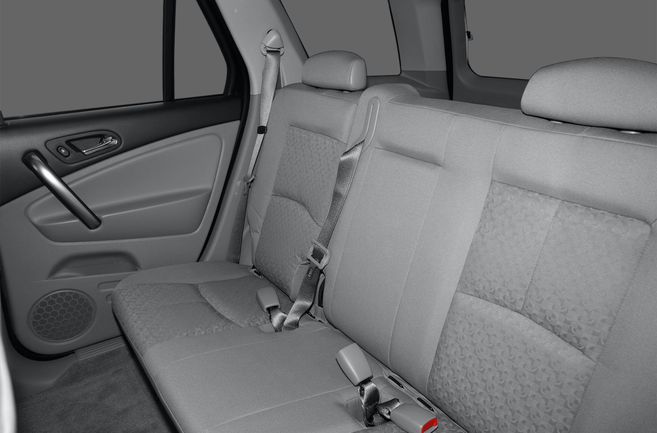 Fabric rear seat with seat belts and door panel interior