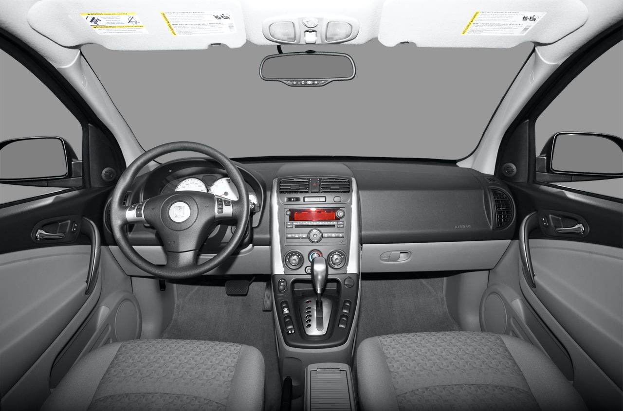 Car interior with dashboard, steering wheel, and center console