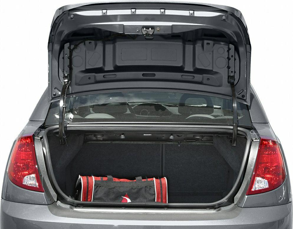 Open rear trunk hatch with visible sports bag and spacious cargo area