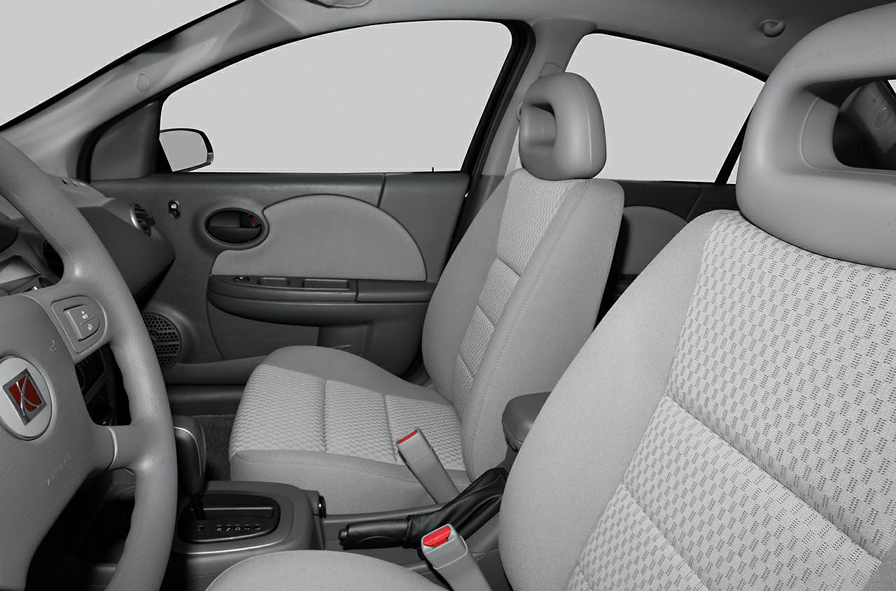 Gray fabric front seats with patterned upholstery and interior cabin layout
