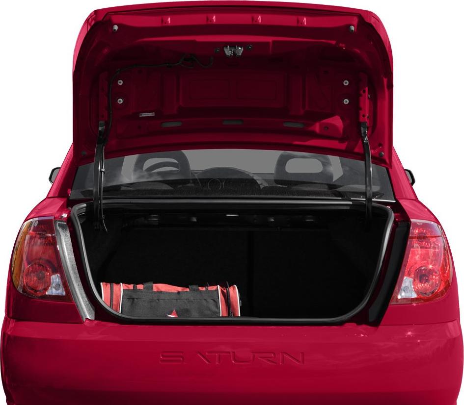 Open trunk of a red coupe with visible rear seats and a duffle bag