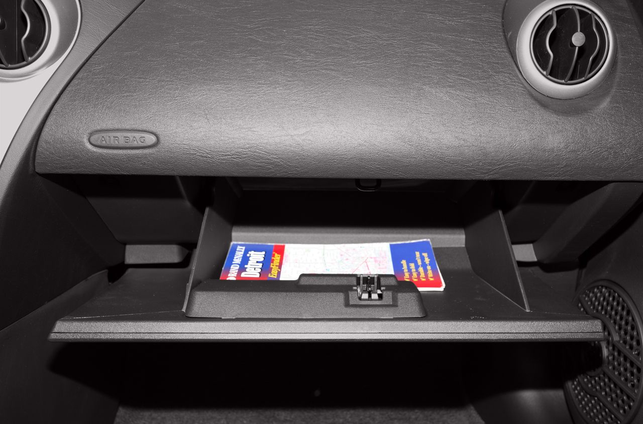 Car glove compartment with dashboard airbag panel and ventilation vents
