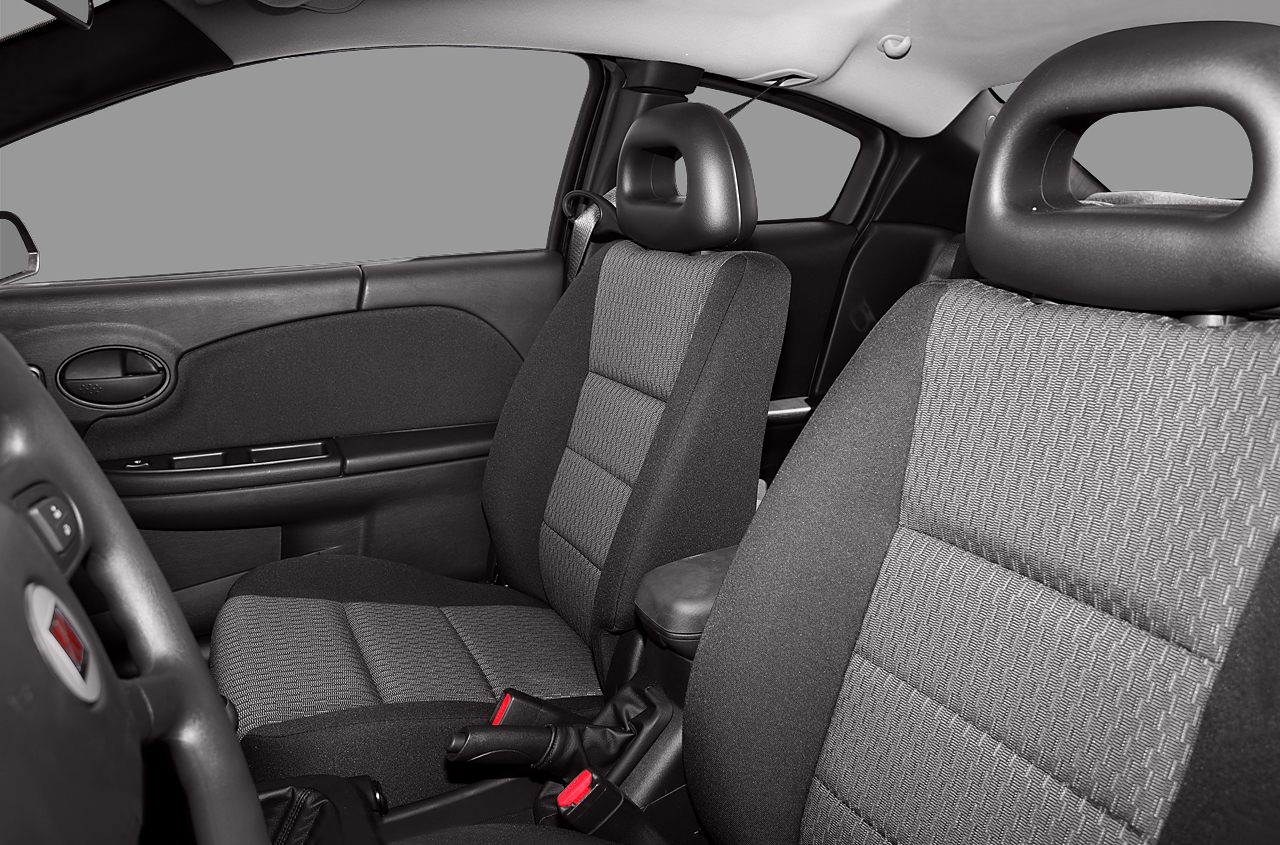 Fabric-covered front seats with ergonomic contours and door panel with handle and controls