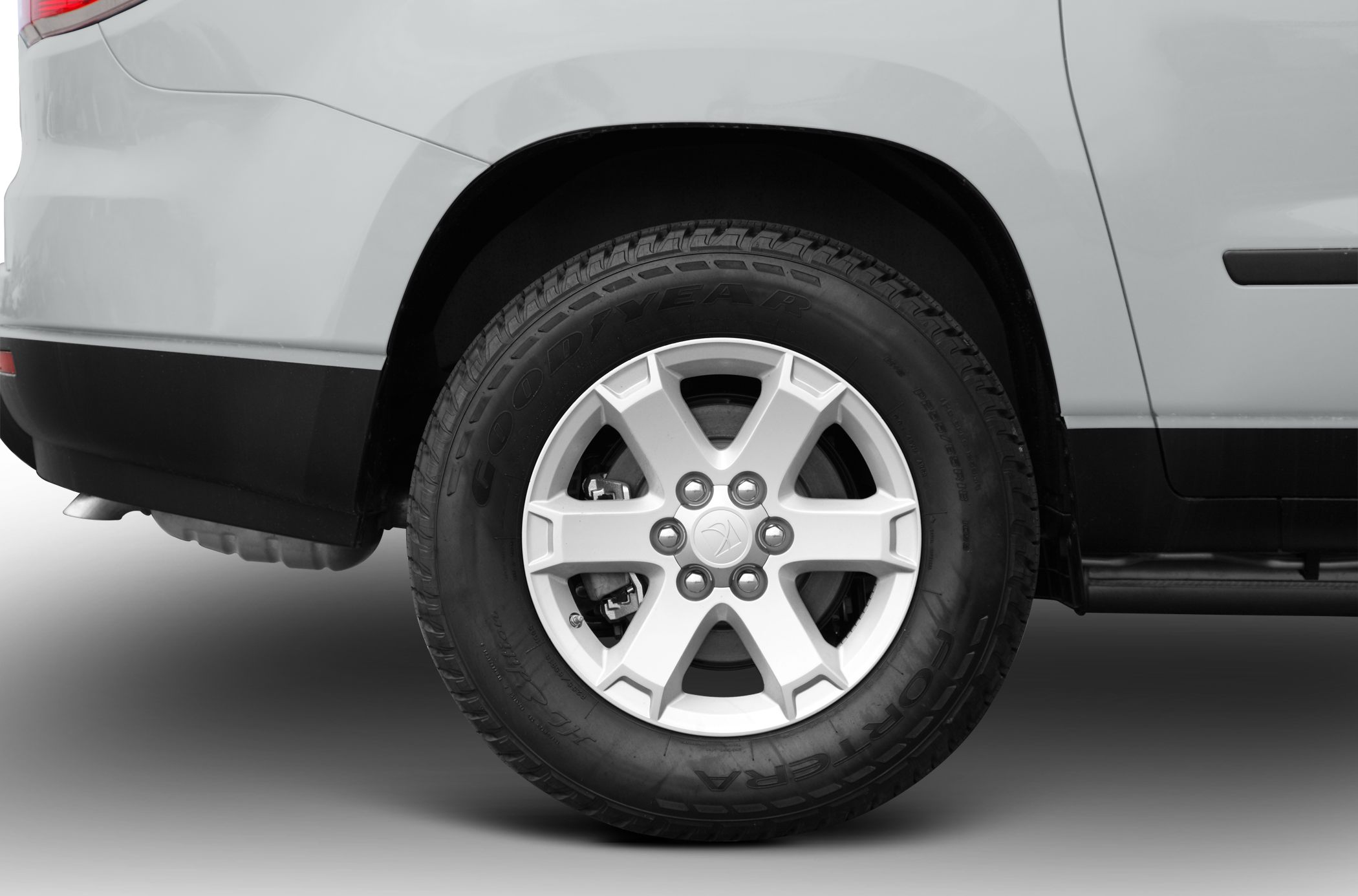 Close-up of rear wheel with alloy rim and Goodyear tire
