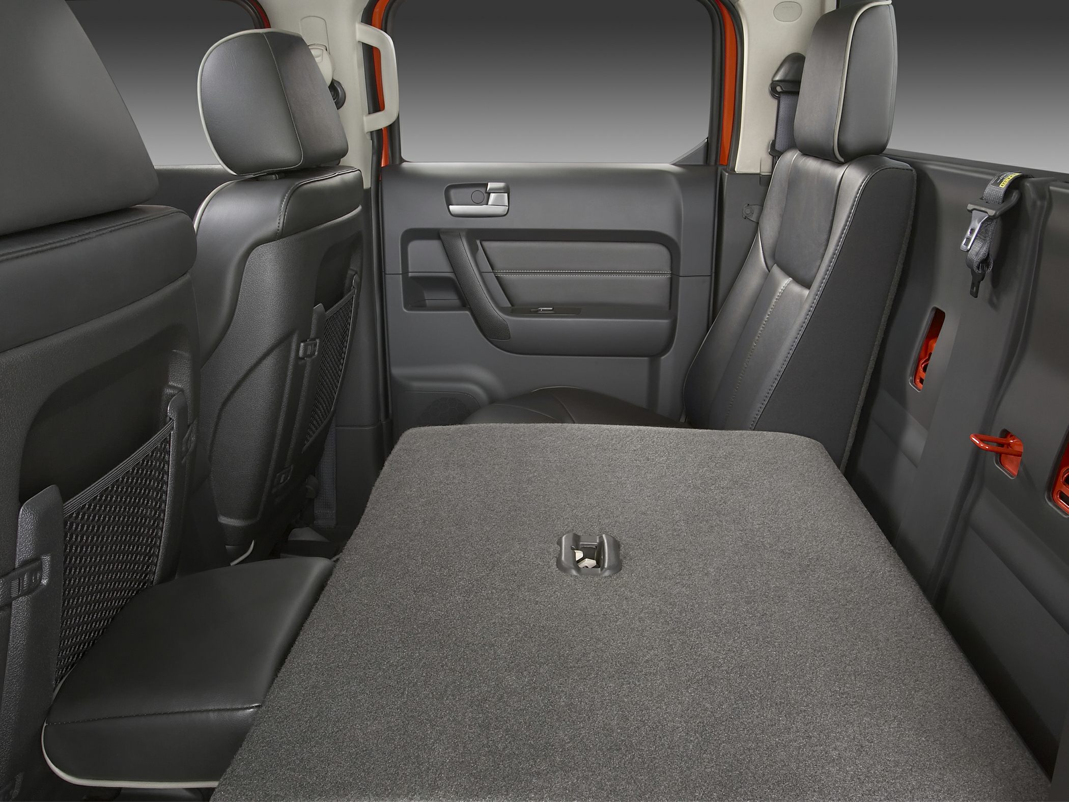 Rear interior with folded seats and door panel details