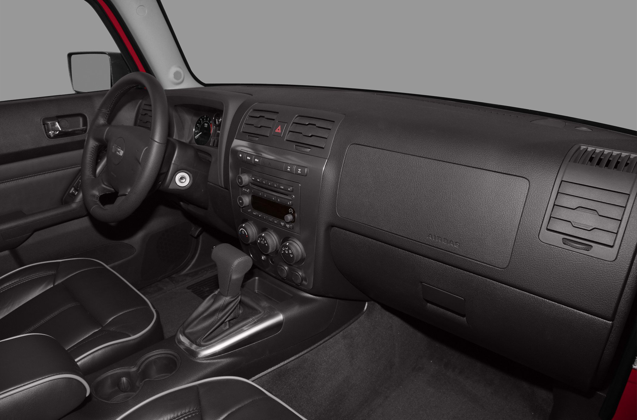 Dashboard, steering wheel, center console with gear shift and controls