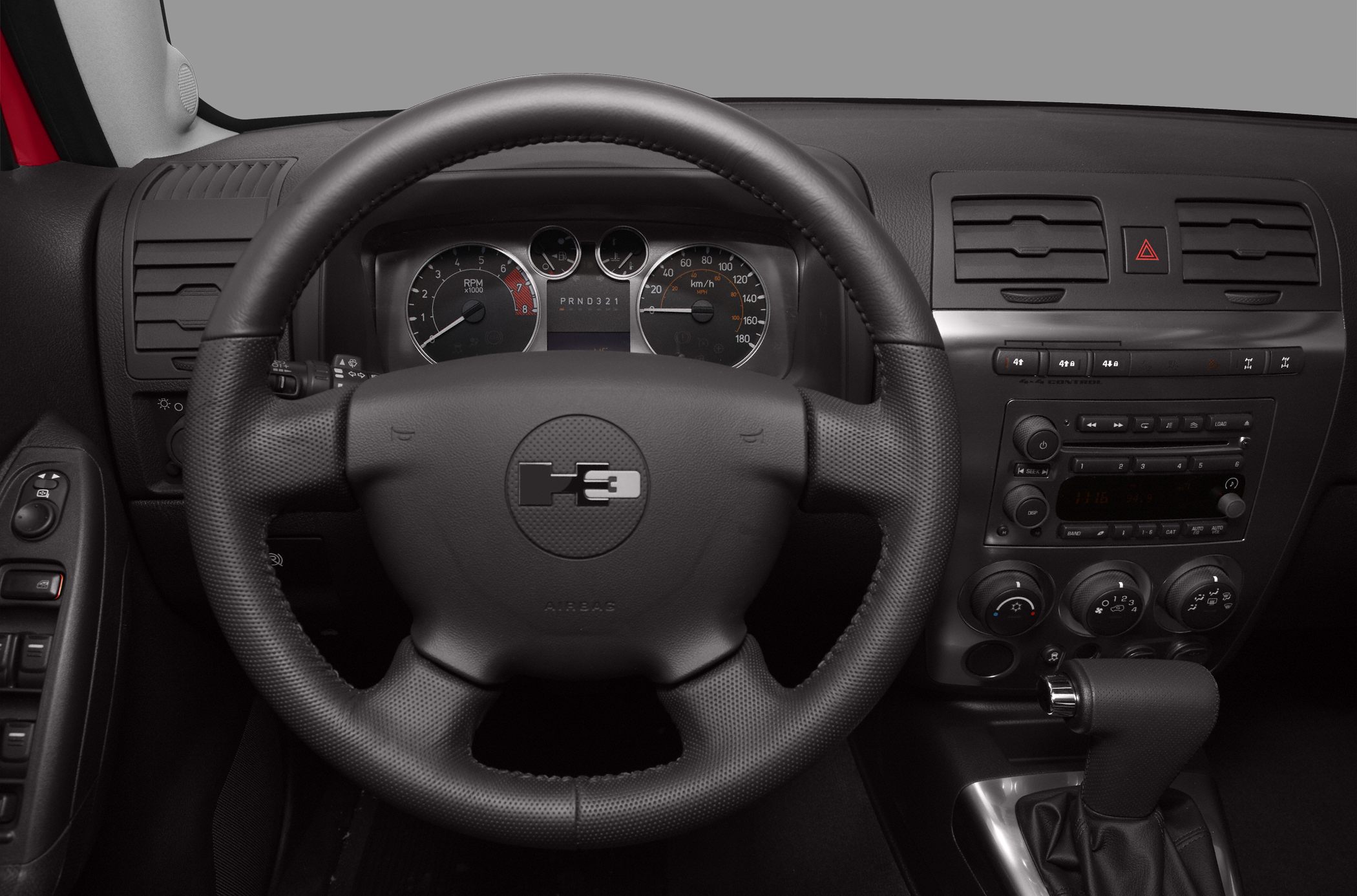 Steering wheel with H3 logo and detailed dashboard controls