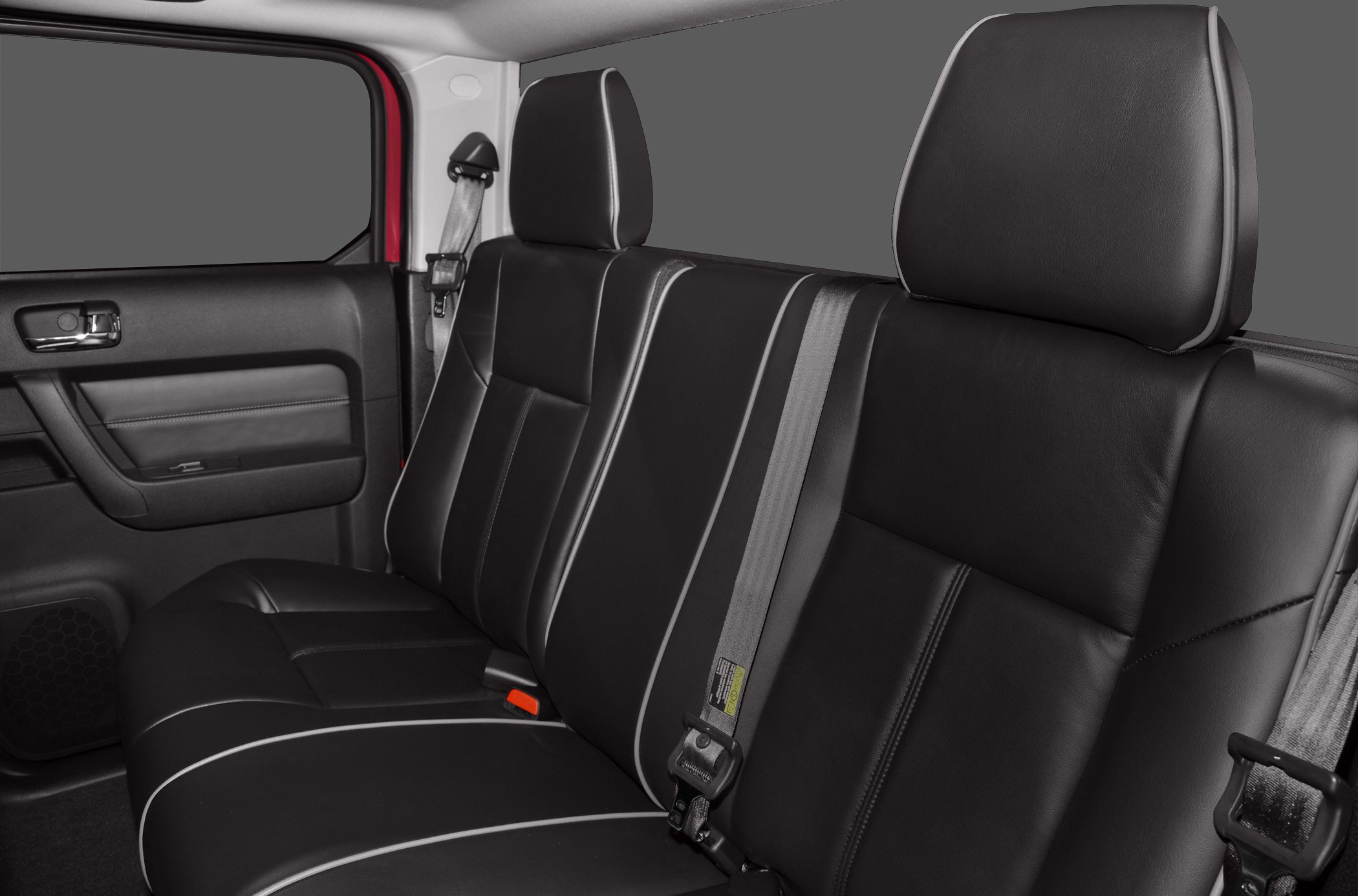Black leather rear seats with white piping and seat belts